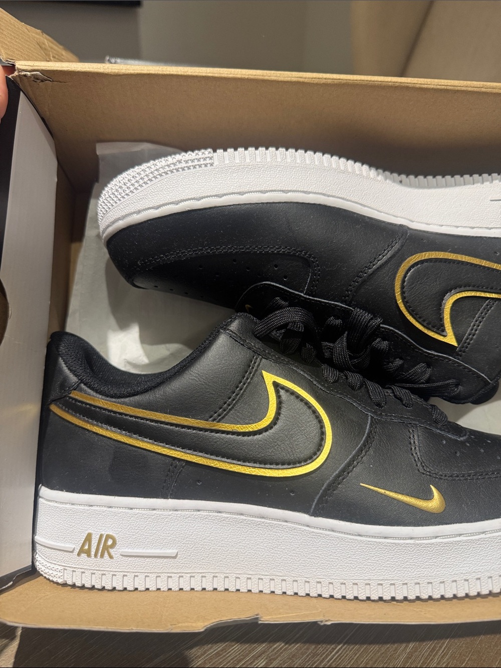 Nike Air Force One Low-Top Sneakers in Black and Gold Accents